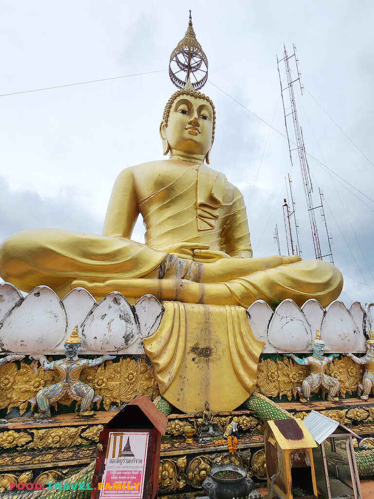 Giant Buddha statue on the summit of Tiger Cave Temple
